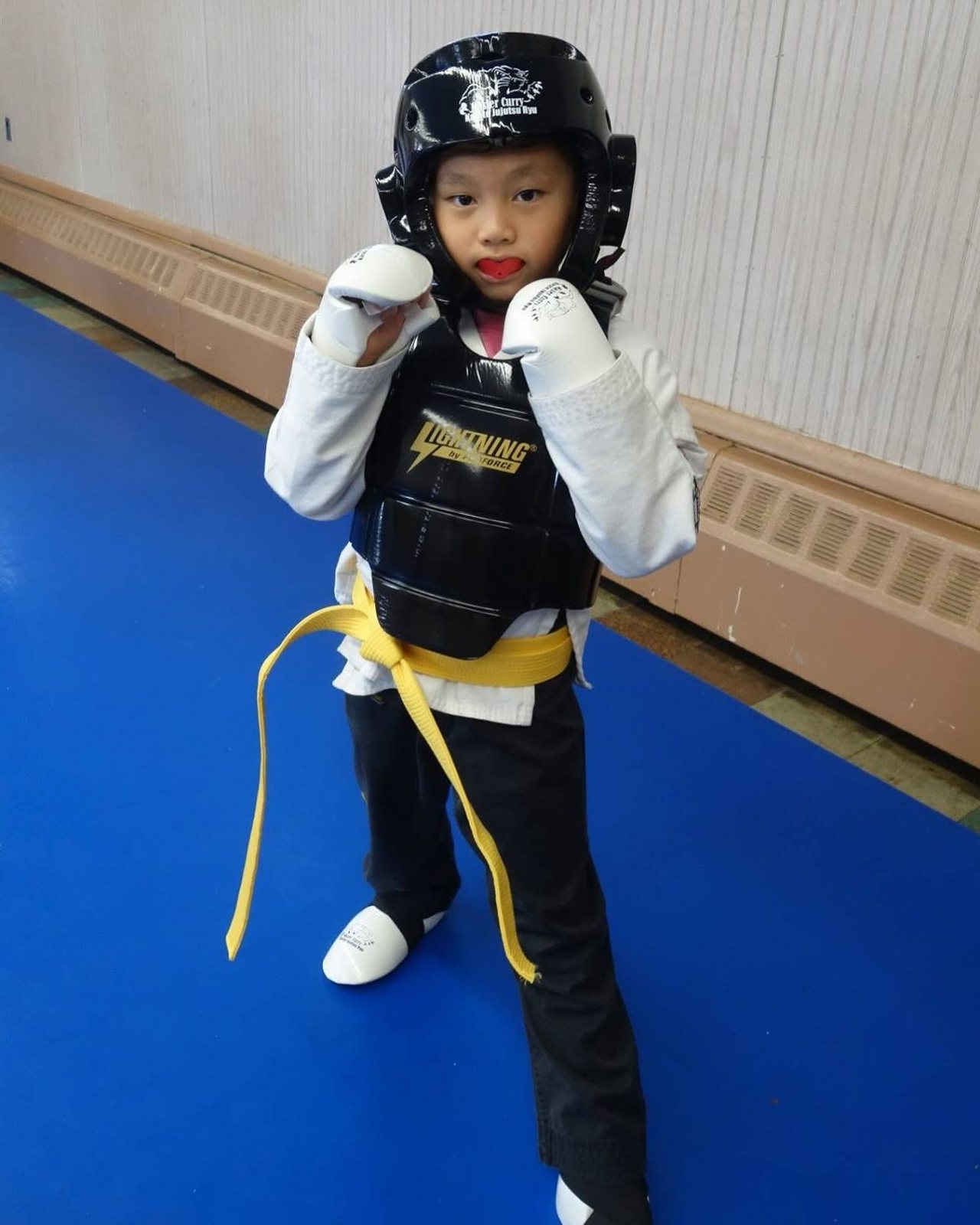 A Is Your Child student smiling proudly after class at Master Curry Karate Jujutsu Ryu in Staten Island